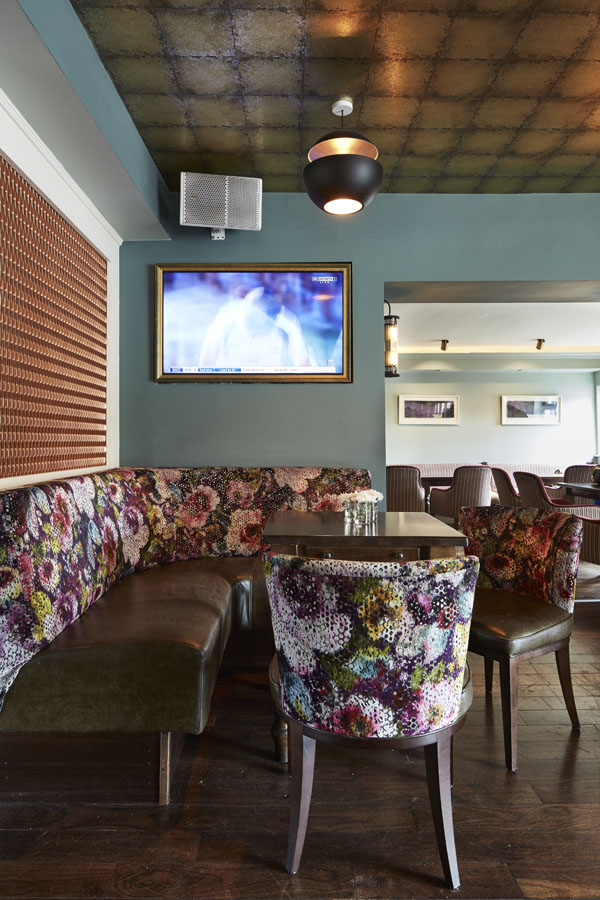 Bar area, comfortable seating tables timber panels pendant lighting, flat screen TV